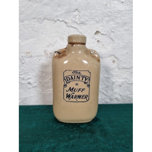 280 - An early 20th century The Dainty Muff Warmer stoneware bottle - approx. 14cm high