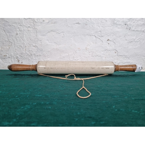 288 - A 1920s Isobel ceramic and boxwood rolling pin - approx. 50cm long