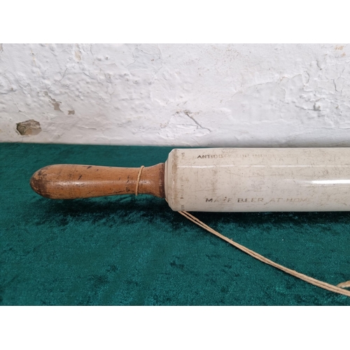 288 - A 1920s Isobel ceramic and boxwood rolling pin - approx. 50cm long