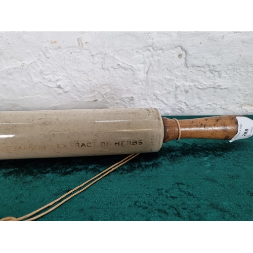 288 - A 1920s Isobel ceramic and boxwood rolling pin - approx. 50cm long