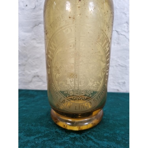 293 - A 1950s Schweppes amber glass porcelain lined syphon - approx. 30cm high