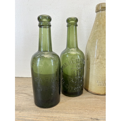 300 - Seven early 20th century stoneware and glass bottles to include J. Lawson Buxton, H. Clarke Stockpor... 