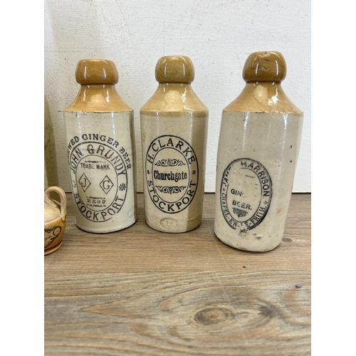 300 - Seven early 20th century stoneware and glass bottles to include J. Lawson Buxton, H. Clarke Stockpor... 