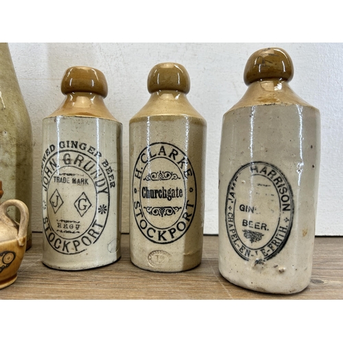 300 - Seven early 20th century stoneware and glass bottles to include J. Lawson Buxton, H. Clarke Stockpor... 