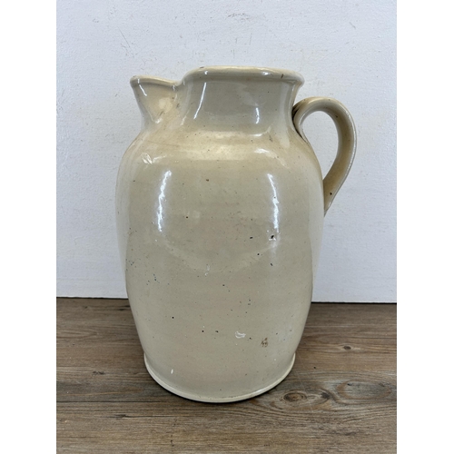 304 - A Doulton & Co Lambeth stoneware jug - approx. 36cm high