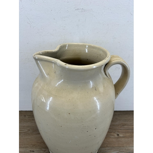 304 - A Doulton & Co Lambeth stoneware jug - approx. 36cm high