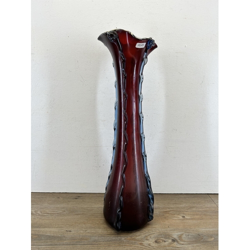 307 - A Victorian cranberry glass vase - approx. 54cm high