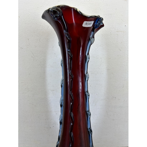 307 - A Victorian cranberry glass vase - approx. 54cm high