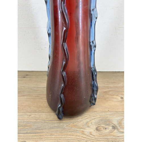 307 - A Victorian cranberry glass vase - approx. 54cm high