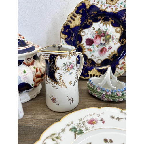 310 - A collection of 19th century and later ceramics to include two hand painted floral pattern plates - ... 