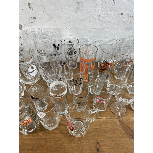 315 - Forty four advertising drinking glasses to include Estrella, Hobgoblin, BrewDog, Camden Town, Vocati... 