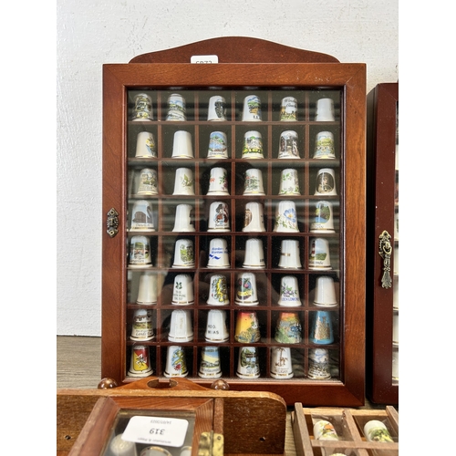 319 - A collection of ceramic thimbles