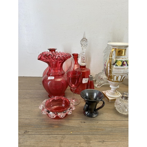 320 - A collection of 19th century and later ceramics and glassware to include cranberry glass, hand paint... 