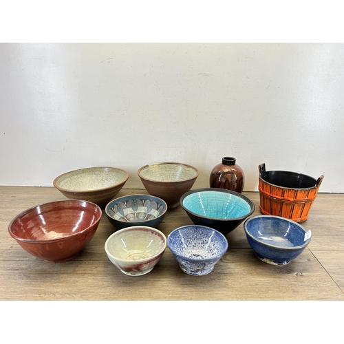 332 - A collection of ceramics to include orange glazed bucket planter, studio pottery etc.