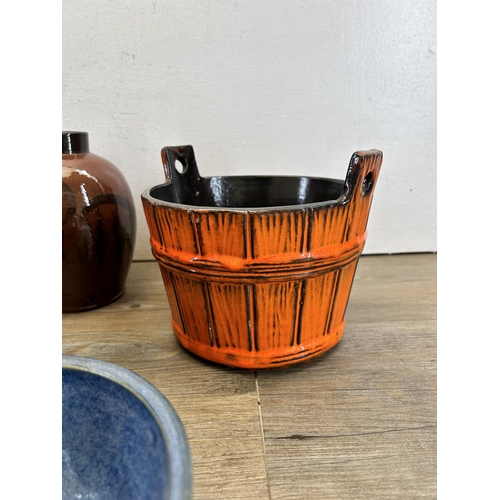 332 - A collection of ceramics to include orange glazed bucket planter, studio pottery etc.