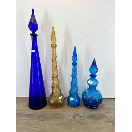 339 - Four 1960s Empoli glass genie bottles - largest approx. 66cm high