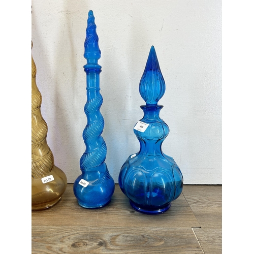 339 - Four 1960s Empoli glass genie bottles - largest approx. 66cm high