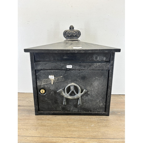 346 - A black painted cast metal wall mountable post box with key - approx. 46cm high x 41.5cm wide x 19cm... 