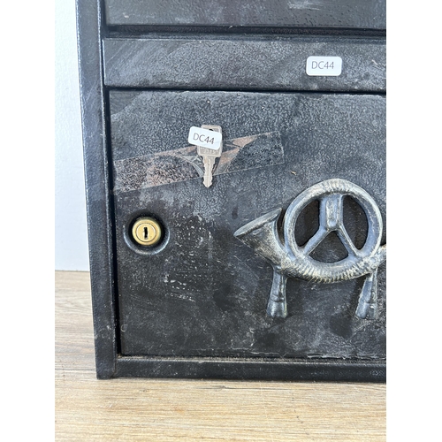 346 - A black painted cast metal wall mountable post box with key - approx. 46cm high x 41.5cm wide x 19cm... 