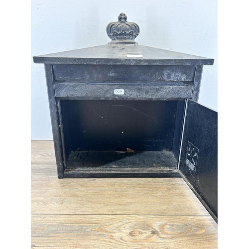 346 - A black painted cast metal wall mountable post box with key - approx. 46cm high x 41.5cm wide x 19cm... 