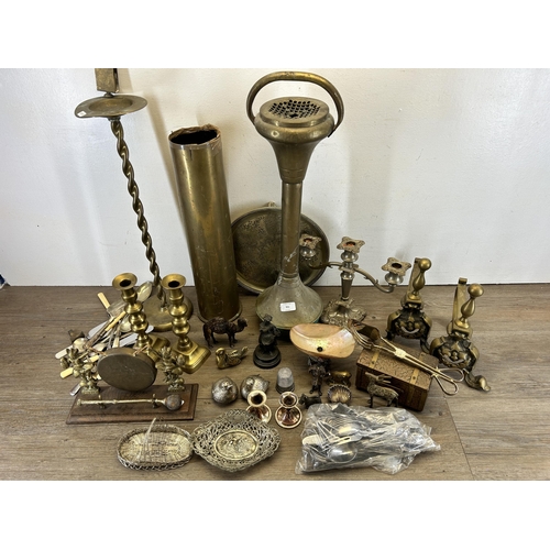 351 - A collection of 19th century and later metalware to include two brass ashtrays on pedestal base, WWI... 