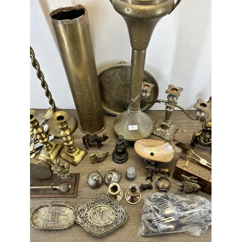 351 - A collection of 19th century and later metalware to include two brass ashtrays on pedestal base, WWI... 