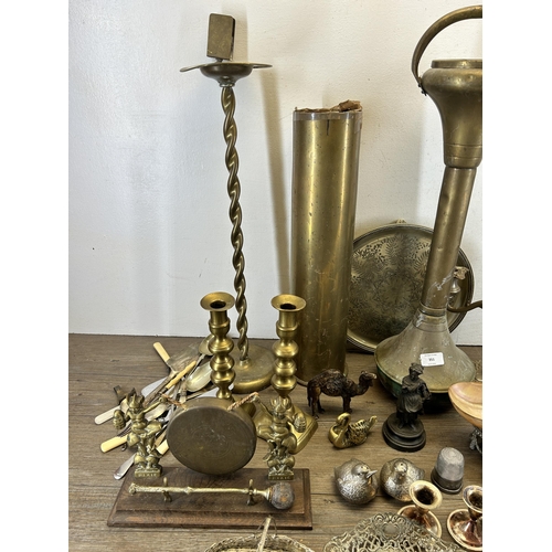 351 - A collection of 19th century and later metalware to include two brass ashtrays on pedestal base, WWI... 