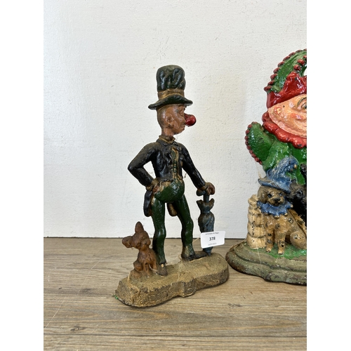 378 - Three late 19th/early 20th century cast iron Punch & Judy door stops - largest approx. 31cm high