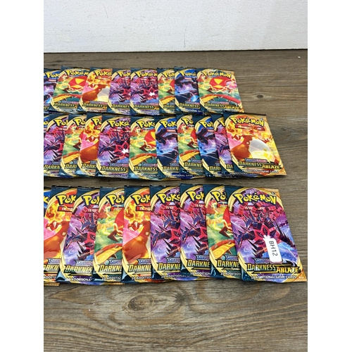 384 - Approx. thirty six packaged and unopened Pokémon Sword & Shield Darkness Ablaze trading cards