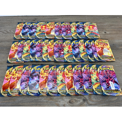 384 - Approx. thirty six packaged and unopened Pokémon Sword & Shield Darkness Ablaze trading cards