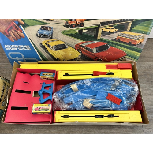 390 - Two vintage boxed Matchbox playsets, one Superfast track.600 double booster racing circuit and one m... 