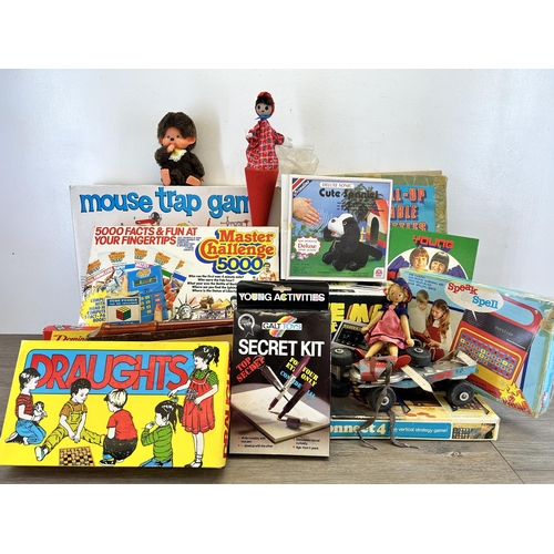 391 - A collection of vintage toys and board games to include boxed Grandstand Cave Man electronic mini ar... 