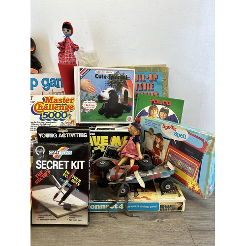 391 - A collection of vintage toys and board games to include boxed Grandstand Cave Man electronic mini ar... 