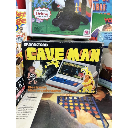 391 - A collection of vintage toys and board games to include boxed Grandstand Cave Man electronic mini ar... 