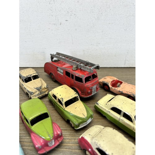 398 - Sixteen vintage die-cast model vehicles to include Hillman Husky, Dingy Supertoys fire engine, Corgi... 