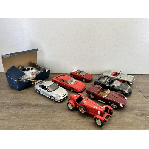 402 - Eight model vehicles to include boxed Autocalia Jaguar E Coupe, Burago Ferrari Testarossa, Burago Al... 