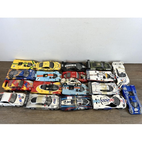 403 - A large collection of die-cast model vehicles to include Autoart 1-18 Porsche 917L, Hall's Madd art ... 