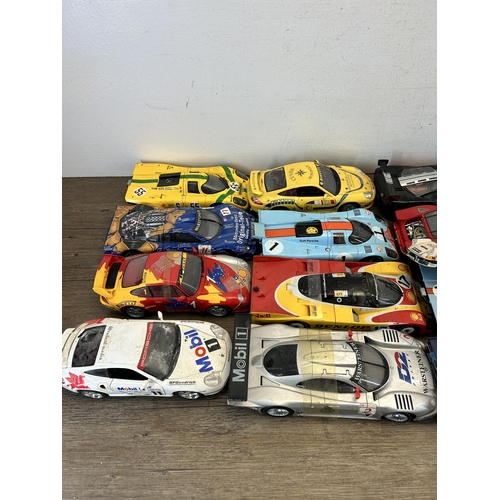 403 - A large collection of die-cast model vehicles to include Autoart 1-18 Porsche 917L, Hall's Madd art ... 