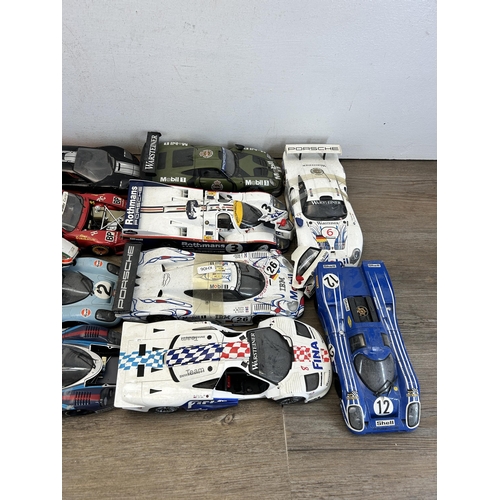 403 - A large collection of die-cast model vehicles to include Autoart 1-18 Porsche 917L, Hall's Madd art ... 