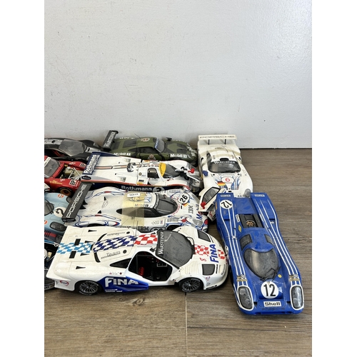 403 - A large collection of die-cast model vehicles to include Autoart 1-18 Porsche 917L, Hall's Madd art ... 