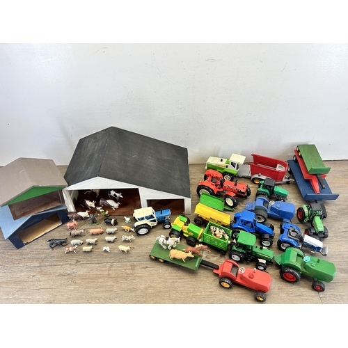 407 - Two boxes containing farm yard related model toys to include scratch built barn, animals, model trac... 