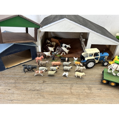 407 - Two boxes containing farm yard related model toys to include scratch built barn, animals, model trac... 