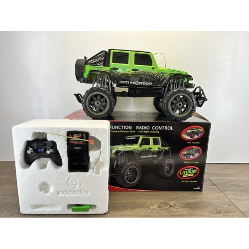 408 - A boxed New Bright Jeep Wrangler full function radio control lithium car with controller, battery an... 