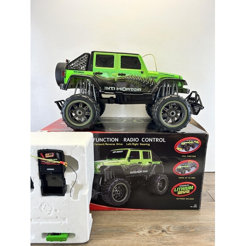 408 - A boxed New Bright Jeep Wrangler full function radio control lithium car with controller, battery an... 