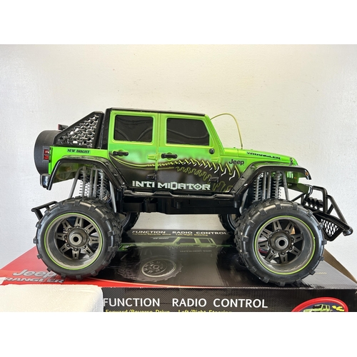 408 - A boxed New Bright Jeep Wrangler full function radio control lithium car with controller, battery an... 