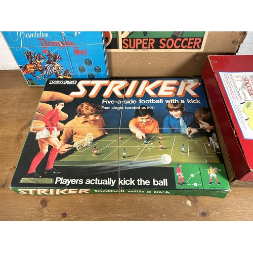 410 - Four vintage boxed board games, P. A. Adolph Subbuteo table football, Parker Striker 5-A-Side, Balyn... 