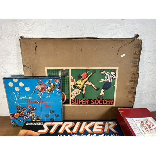 410 - Four vintage boxed board games, P. A. Adolph Subbuteo table football, Parker Striker 5-A-Side, Balyn... 