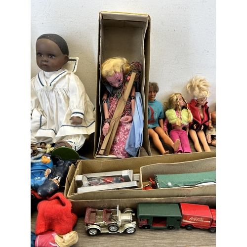 412 - A collection of vintage toys to include boxed Pelham Puppets Marlborough Wilts Marionette, Barbie do... 