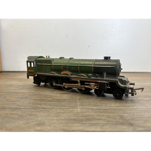 415 - Four boxes containing a large collection of mainly Tri-ang model railway accessories to include Brit... 