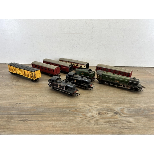 415 - Four boxes containing a large collection of mainly Tri-ang model railway accessories to include Brit... 